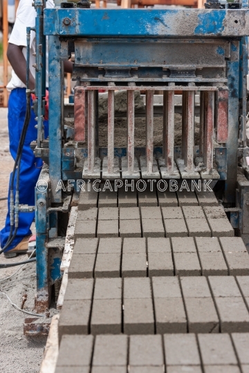 man and bricks machine