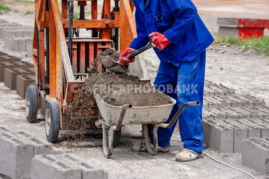 wheelbarrow and bricks machine